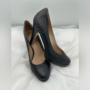 Size 7 black heels with studded detail at back of heel.